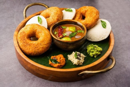 2Pc Idli , 2Pc Vada .Served With Sambher And Nariyal Chutney.