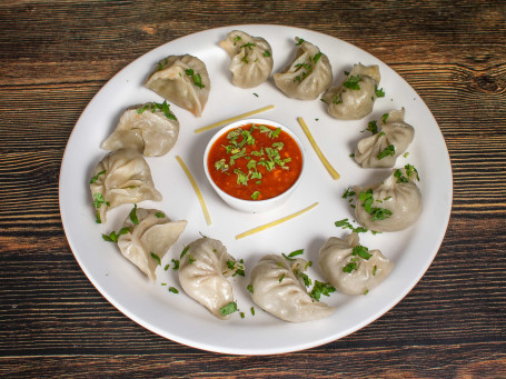 Steam Veg Momos 12 Pcs Served With Red Spicy Chutney Mevnies