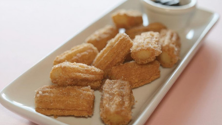 Dozen Churro Bites With Chocolate Sauce